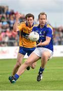 4 July 2015; Brian Kavanagh, Longford, in action against Kevin Harnett, Clare. GAA Football All-Ireland Senior Championship, Round 2A, Clare v Longford. Cusack Park, Ennis, Co. Clare. Picture credit: Stephen McCarthy / SPORTSFILE