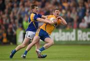 4 July 2015; Enda Coughlan, Clare, in action against Liam Connerton, Longford. GAA Football All-Ireland Senior Championship, Round 2A, Clare v Longford. Cusack Park, Ennis, Co. Clare. Picture credit: Stephen McCarthy / SPORTSFILE