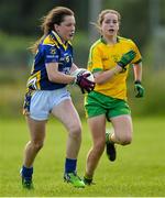 4 July 2015; Ciara Dwan, Tipperary, in action against Clodagh Skelly, Donegal. All Ireland Ladies Football U14 'B' Championship, Donegal v Tipperary. Ballymahon, Co. Longford. Picture credit: David Maher / SPORTSFILE
