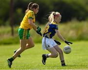 4 July 2015; Cailin Napier, Tipperary, in action against Clodagh Skelly, Donegal. All Ireland Ladies Football U14 'B' Championship, Donegal v Tipperary. Ballymahon, Co. Longford. Picture credit: David Maher / SPORTSFILE