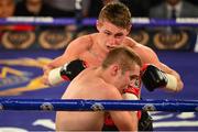 4 July 2015; Ryan Burnett, Belfast, Northern Ireland, exchanges punches with Csaba Kovacs, Budapest, Hungary in their bantamweight bout. New Beginning Fight Night. National Stadium, Dublin. Picture credit: Cody Glenn / SPORTSFILE