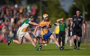 4 July 2015; Conor McGrath, Clare, in action against Dan Currams, Offaly. GAA Hurling All-Ireland Senior Championship, Round 1, Clare v Offaly. Cusack Park, Ennis, Co. Clare. Picture credit: Stephen McCarthy / SPORTSFILE