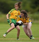 4 July 2015; Nicola O'Dwyer, Tipperary, in action against Claire Doherty, Donegal. All Ireland Ladies Football U14 'B' Championship, Donegal v Tipperary. Ballymahon, Co. Longford. Picture credit: David Maher / SPORTSFILE