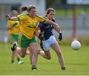 4 July 2015; Ava Fennessey, Tipperary, in action against Rionach Giles McMenamin, Donegal. All Ireland Ladies Football U14 'B' Championship, Donegal v Tipperary. Ballymahon, Co. Longford. Picture credit: David Maher / SPORTSFILE