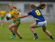 4 July 2015; Sarah Harkin, Donegal, in action against Marie Creedon, Tipperary. All Ireland Ladies Football U14 'B' Championship, Donegal v Tipperary. Ballymahon, Co. Longford. Picture credit: David Maher / SPORTSFILE