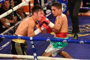 4 July 2015; Jamie Conlan, Northern Ireland, left, exchanges puches with Junior Granados, Mexico, during their flyweight bout. New Beginning Fight Night. National Stadium, Dublin. Picture credit: Cody Glenn / SPORTSFILE