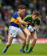 5 July 2015; Conor Geane, Kerry, in action against Tommy Lowry, Tipperary. Electric Ireland Munster GAA Football Minor Championship Final, Kerry v Tipperary. Fitzgerald Stadium, Killarney, Co. Kerry.  Picture credit: Brendan Moran / SPORTSFILE