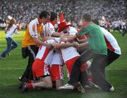 21 September 2008; Tyrone players Kevin Hughes, Brian McGuigan, Sean Cavanagh and supporters celebrate at the final whistle. GAA Football All-Ireland Senior Championship Final, Kerry v Tyrone, Croke Park, Dublin. Picture credit: Ray McManus / SPORTSFILE