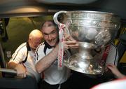 21 September 2008; Tyrone manager Mickey Harte brings the Sam Maguire cup onto the bus. GAA Football All-Ireland Senior Championship Final, Kerry v Tyrone, Croke Park, Dublin. Picture credit: Stephen McCarthy / SPORTSFILE
