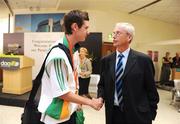 19 September 2008; Michael McKillop, from Glengormley, Co. Antrim, who won a gold medal in the Men's 800m - T37, is greeted by John Tracey, Irish Sports Council, at Dublin Airport as the Irish Paralympic Team arrived home from Beijing. Dublin Airport, Dublin. Picture credit: Stephen McCarthy / SPORTSFILE