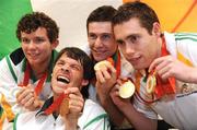 19 September 2008; Irish athletes, from left, Darragh McDonald, from Gorey, Co. Wexford, Gabriel Shelly, from Bagenalstown, Co. Carlow, who won a bronze medal in the Boccia Mixed Individual - BC1, who won a silver medal in the Men's 400m Freestyle - S6 Final, Michael McKillop, from Glengormley, Co. Antrim, who won a gold medal in the Men's 800m - T37 and Jason Smyth, from Eglinton, Co. Derry, who won two gold medals in the Men's 200m -T13 Final and Men's 100m T13 Final, at Dublin Airport as the Irish Paralympic Team arrived home from Beijing. Dublin Airport, Dublin. Picture credit: Stephen McCarthy / SPORTSFILE