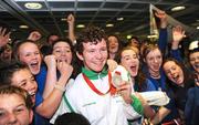 19 September 2008; Darragh McDonald, from Gorey, Co. Wexford, who won a silver medal in the Men's 400m Freestyle - S6 Final, is congratulated by members of his local Asguard Swimming Club, Arklow, at Dublin Airport as the Irish Paralympic Team arrived home from Beijing. Dublin Airport, Dublin. Picture credit: Stephen McCarthy / SPORTSFILE