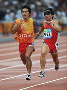 8 September 2008;  Vietnam's Cuong van Dao, runs with his guide during the Men's 100m - T11 Round 1 Heat 2. Beijing Paralympic Games 2008, Men's 100m - T11 Round 1 Heat 2, National Stadium, Olympic Green, Beijing, China. Picture credit: Brian Lawless / SPORTSFILE