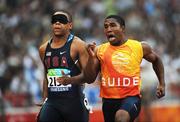 8 September 2008; USA's Nelacey Porter, runs with his guide during the Men's 100m - T11 Round 1 Heat 3. Beijing Paralympic Games 2008, Men's 100m - T11 Round 1 Heat 3, National Stadium, Olympic Green, Beijing, China. Picture credit: Brian Lawless / SPORTSFILE