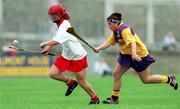 12 August 2000; Ciara Healy of Cork in action against Sandra Carr of Wexford during the All-Ireland Senior Camogie Championship Semi-Final match between Cork and Wexford at Parnell Park in Dublin. Photo by David Maher/Sportsfile