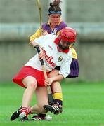 12 August 2000; Ciara Healy of Cork in action against Sandra Carr of Wexford during the All-Ireland Senior Camogie Championship Semi-Final match between Cork and Wexford at Parnell Park in Dublin. Photo by David Maher/Sportsfile