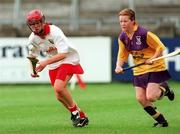 12 August 2000; Mary O'Connor of Cork in action against Kate Kelly of Wexford during the All-Ireland Senior Camogie Championship Semi-Final match between Cork and Wexford at Parnell Park in Dublin. Photo by David Maher/Sportsfile