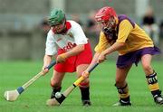 12 August 2000; Caoimhe Harrington of Cork in action against Laura Corrigan of Wexford during the All-Ireland Senior Camogie Championship Semi-Final match between Cork and Wexford at Parnell Park in Dublin. Photo by David Maher/Sportsfile