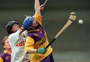 12 August 2000; Evelyn Quigley of Wexford in action against Ursula Troy of Cork during the All-Ireland Senior Camogie Championship Semi-Final match between Cork and Wexford at Parnell Park in Dublin. Photo by David Maher/Sportsfile