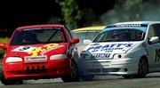20 August 2000; Mervyn Miller, left, takes the first bend with Clive Pratt during the Alasta Autos Italian Saloon Car Cup during the Phoenix Park Motor Races at the Phoenix Park in Dublin. Photo by Matt Browne/Sportsfile