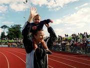 20 August 2000; Sonia O'Sullivan of Ballymore Cobh AC, Cork, with her daughter Ciara, celebrates winning the Women's 1500m Final during the AAI National Track and Field Championships of Ireland at Morton Stadium in Dublin. Photo by Pat Murphy/Sportsfile