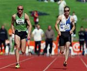 20 August 2000; Paul Brizzel of Ballymena and Antrim AC, Antrim, leads Gordon Kennedy of Tullamore Harriers AC, Offaly, on his way to winning the Men's 100m Final during the AAI National Track and Field Championships of Ireland at Morton Stadium in Dublin. Photo by Brendan Moran/Sportsfile