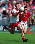 20 August 2000; Damien Canning of Derry in action against Noel O'Leary of Cork during the All-Ireland Minor Football Championship Semi-Final match between Cork and Derry at Croke Park in Dublin. Photo by Aoife Rice/Sportsfile