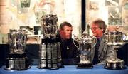 23 August 2000; Michael MacCarthy, right, great grandson of Liam MacCarthy, and Uachtarán Chumann Lúthchleas Gael Sean McCague pictured with the four All-Ireland Senior Hurling Championship trophies played for since the late 19th century, which were together for the first time, at the opening of an exhibition commemorating Liam MacCarthy at the GAA Museum in Croke Park Photo by David Maher/Sportsfile