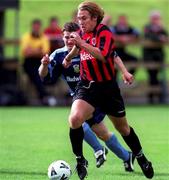 27 August 2000; Kevin Hunt of Bohemians in action against Ciaran Kavanagh of UCD during the Eircom League Premier Division match between UCD and Bohemians at Belfield Park in Dublin. Photo by Ray Lohan/Sportsfile