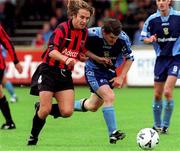 27 August 2000; Kevin Hunt of Bohemians in action against Ciaran Kavanagh of UCD during the Eircom League Premier Division match between UCD and Bohemians at Belfield Park in Dublin. Photo by David Maher/Sportsfile