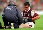 27 August 2000; Padraig Joyce of Galway is attended to by medical personnel during the Bank of Ireland All-Ireland Senior Football Championship Semi-Final match between Galway and Kildare at Croke Park in Dublin. Photo by Ray McManus/Sportsfile