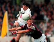 27 August 2000; Michael Donnellan of Galway attempts to block a shot by Martin Lynch of Kildare during the Bank of Ireland All-Ireland Senior Football Championship Semi-Final match between Galway and Kildare at Croke Park in Dublin. Photo by Matt Browne/Sportsfile