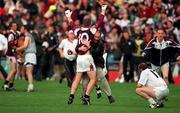 27 August 2000; Paul Clancy of Galway is congratulated by a supporter alongside a dejected David Hughes of Kildare after the Bank of Ireland All-Ireland Senior Football Championship Semi-Final match between Galway and Kildare at Croke Park in Dublin. Photo by Matt Browne/Sportsfile