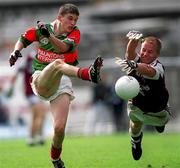 27 August 2000; Tony Geraghty of Mayo has his shot blocked by  Finian Newman of Westmeath during the All-Ireland Minor Football Championship Semi-Final match between Mayo and Westmeath at Croke Park in Dublin. Photo by Ray McManus/Sportsfile