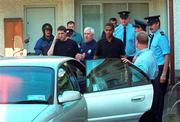 29 August 2000; Republic of Ireland players Mark Kennedy and Phil Babb, accompanied by Mick Byrne and team security officer Tony Hickey, leave Dublin Dictrict Court having been arrested in Dublin the previous night. Both players were subsequently dropped from the Republic of Ireland squad for the FIFA World Cup Qualifier in the Netherlands. Photo by Ray Lohan/Sportsfile