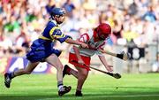 3 September 2000; Ciara Healy of Cork in action against Una O'Dwyer of Tipperary during the All-Ireland Senior Camogie Championship Final match between Cork and Tipperary at Croke Park in Dublin. Photo by Aoife Rice/Sportsfile