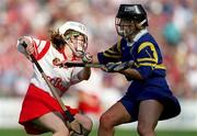 3 September 2000; Elaine Burke of Cork in action against Claire Madden of Tipperary during the All-Ireland Senior Camogie Championship Final match between Cork and Tipperary at Croke Park in Dublin. Photo by Aoife Rice/Sportsfile