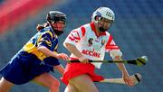 3 September 2000; Una O'Donoghue of Cork in action against Suzanne Kelly of Tipperary during the All-Ireland Senior Camogie Championship Final match between Cork and Tipperary at Croke Park in Dublin. Photo by Brendan Moran/Sportsfile