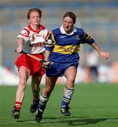 3 September 2000; Angela McDermott of Tipperary in action against Linda Mellerick of Cork during the All-Ireland Senior Camogie Championship Final match between Cork and Tipperary at Croke Park in Dublin. Photo by Aoife Rice/Sportsfile