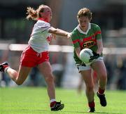 2 September 2000; Claire Egan of Mayo in action against Lynette Hughes of Tyrone during the TG4 All-Ireland Ladies Football Senior Championship Semi-Final match between Mayo and Tyrone at Croke Park in Dublin. Photo by Brendan Moran/Sportsfile