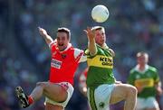 2 September 2000; Tomás Ó Sé of Kerry in action against Barry O'Hagan of Armagh during the Bank of Ireland All-Ireland Senior Football Championship Semi-Final replay match between Kerry and Armagh at Croke Park in Dublin. Photo by Brendan Moran/Sportsfile