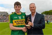 5 July 2015; Pictured is John Drinan, Customer Relationship Manager for Electric Ireland, proud sponsor of the GAA All-Ireland Minor Championships, presenting Conor Geaney, Kerry, with the Player of the Match award for his outstanding performance in the Electric Ireland Munster Minor Football Championship Final. Throughout the Championship fans can follow the action, support the Minors and be a part of something major through the hashtag #ThisIsMajor. Fitzgerald Stadium, Killarney, Co. Kerry. Picture credit: Brendan Moran / SPORTSFILE