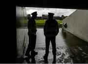 5 July 2015; Members of An Garda Síochána shelter from the rain in the tunnel before the game. GAA Hurling All-Ireland Senior Championship, Round 1, Westmeath v Limerick. Cusack Park, Mullingar, Co. Westmeath. Picture credit: Piaras Ó Mídheach / SPORTSFILE