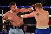 4 July 2015; Sean &quot;Big Sexy&quot; Turner, Dublin, exchanges punches with Janis Ginters, Riga, Latvia,  during their heavyweight bout. New Beginning Fight Night. National Stadium, Dublin. Picture credit: Cody Glenn / SPORTSFILE