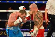 4 July 2015; Anthony Fitzgerald, left, Dublin, exchanges punches with Kieron Gray, England, during their middleweight bout. New Beginning Fight Night. National Stadium, Dublin. Picture credit: Cody Glenn / SPORTSFILE