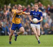 4 July 2015; Barry O’Farrell, Longford, in action against Pat Burke, Clare. GAA Football All-Ireland Senior Championship, Round 2A, Clare v Longford. Cusack Park, Ennis, Co. Clare. Picture credit: Stephen McCarthy / SPORTSFILE