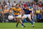 4 July 2015; Gary Brennan, Clare, in action against Michael Quinn, Longford. GAA Football All-Ireland Senior Championship, Round 2A, Clare v Longford. Cusack Park, Ennis, Co. Clare. Picture credit: Stephen McCarthy / SPORTSFILE
