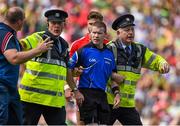 5 July 2015; A member of An Garda Siochana prevents Cork manager Brian Cuthbert from attempting to speak to referee Padraig Hughes after the final whistle. Munster GAA Football Senior Championship Final, Kerry v Cork. Fitzgerald Stadium, Killarney, Co. Kerry. Picture credit: Brendan Moran / SPORTSFILE