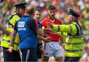 5 July 2015; Cork manager Brian Cuthbert attempts to speak to referee Padraig Hughes, 3rd from left, after the final whistle. Munster GAA Football Senior Championship Final, Kerry v Cork. Fitzgerald Stadium, Killarney, Co. Kerry. Picture credit: Brendan Moran / SPORTSFILE