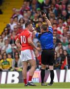 5 July 2015; Paul Kerrigan, Cork, is issued with a black card by referee Padraig Hughes. Munster GAA Football Senior Championship Final, Kerry v Cork. Fitzgerald Stadium, Killarney, Co. Kerry. Picture credit: Stephen McCarthy / SPORTSFILE